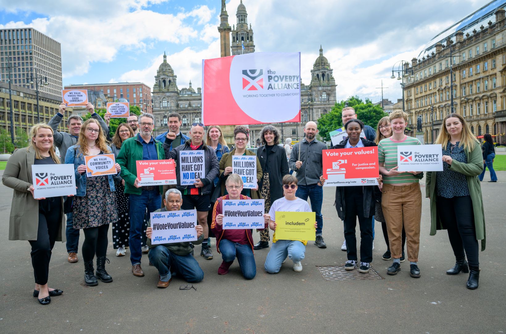 Poverty Alliance members take part in a #VoteYourValues photocall