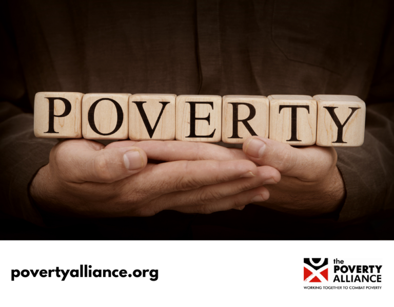 A stock image of a child holding building blocks spelling out 'Poverty'